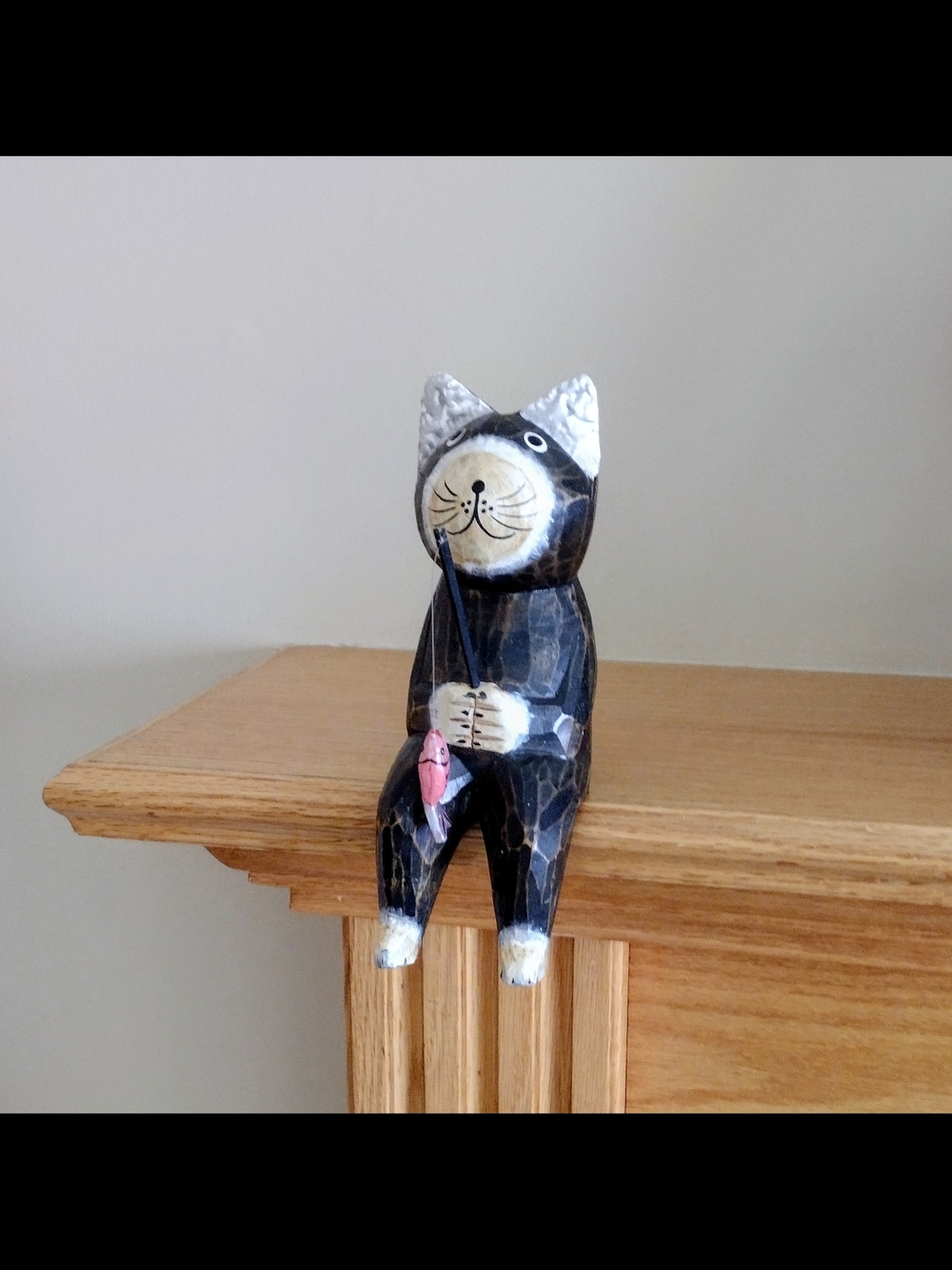 Handcrafted Wooden Black & White Fishing Cat Figurine with Pink Fish